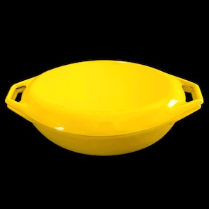 May include: A bright yellow, oval-shaped casserole dish with a matching lid. The dish has two rectangular handles on either side. The glossy finish and solid color suggest a modern kitchenware design.
