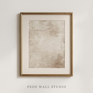 May include: A framed abstract art print with a neutral color palette. The artwork features a textured, beige and brown design within a gold-colored frame. The text "PEDE WALL STUDIO" is at the bottom.