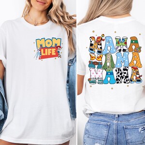 a woman wearing a mom life t - shirt
