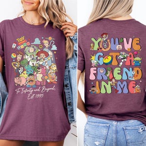 a woman wearing a purple tshirt that says you've got a friend