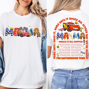 a woman wearing a t - shirt with cars on it