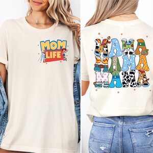 a woman wearing a mom life t - shirt