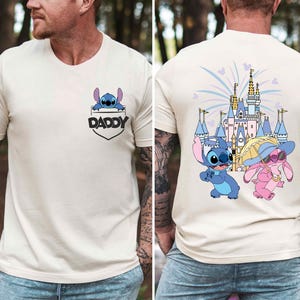 a man with tattoos wearing a disney shirt