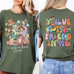 a woman wearing a tshirt that says you've got a friend in