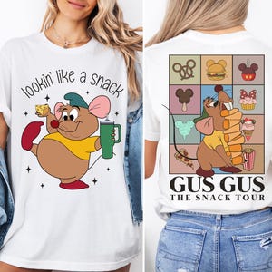 a woman wearing a t - shirt with a mouse on it