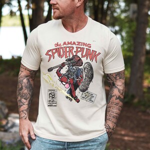 a man with a tattoo on his arm holding a frisbee