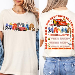 a woman wearing a t - shirt with cars on it