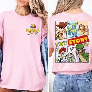 a woman wearing a pink toy story t - shirt