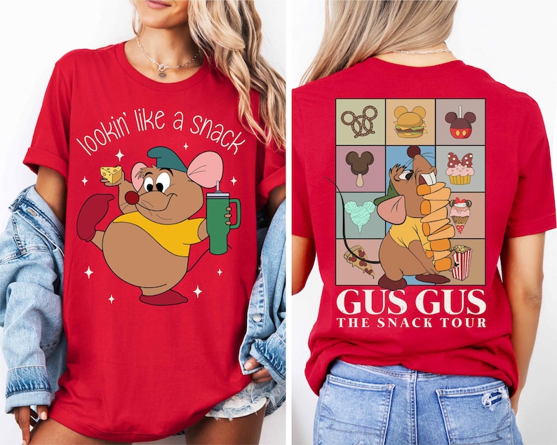a woman wearing a red tshirt with an image of a mouse holding a