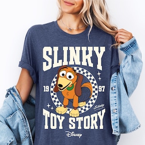 a woman wearing a shirt that says slinky is a toy story