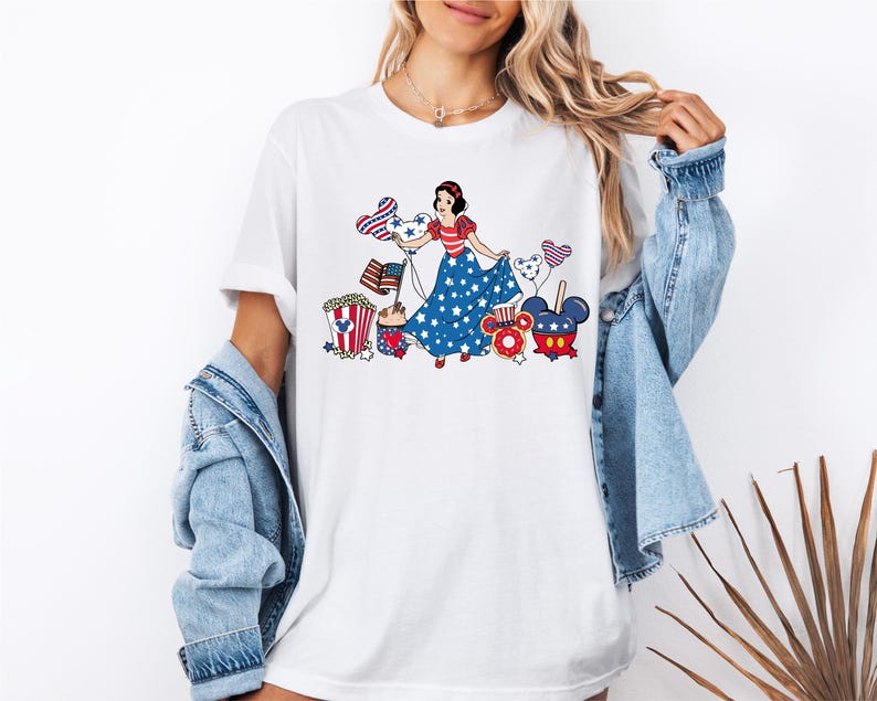a woman wearing a white tee shirt with a patriotic design