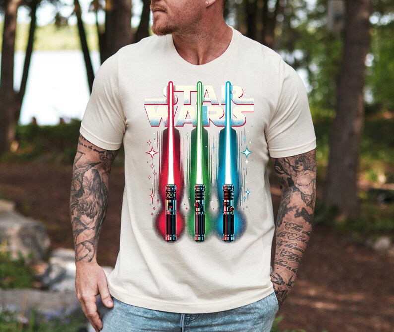 a man wearing a star wars t - shirt holding a baseball bat