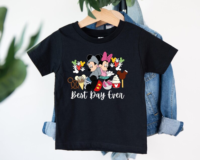 a black shirt with mickey mouse and minnie mouse on it