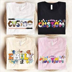 four t-shirts with personalized names and designs printed on them.