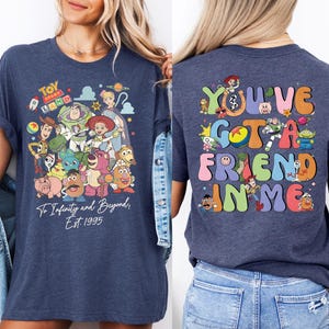 two women wearing tshirts that say you've got a friend in me