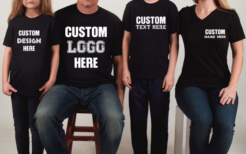 a group of three people wearing matching t - shirts
