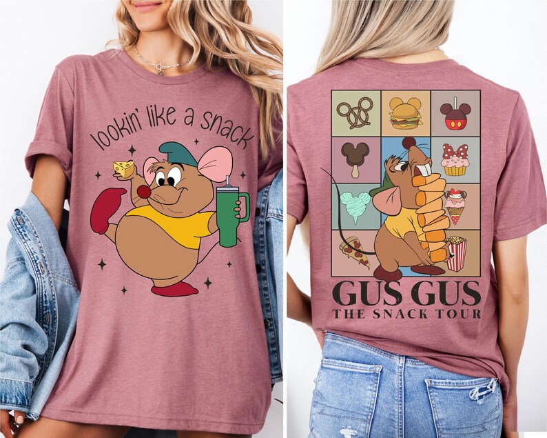 a woman wearing a pink tshirt with a cartoon character on it