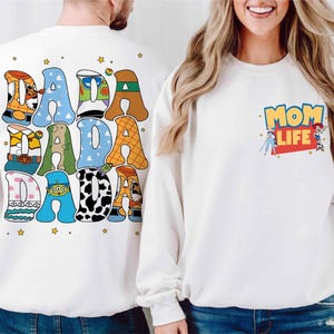 a man and a woman wearing matching sweatshirts