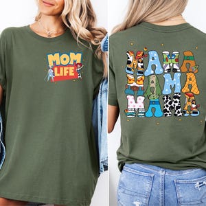 a woman wearing a mom life t - shirt