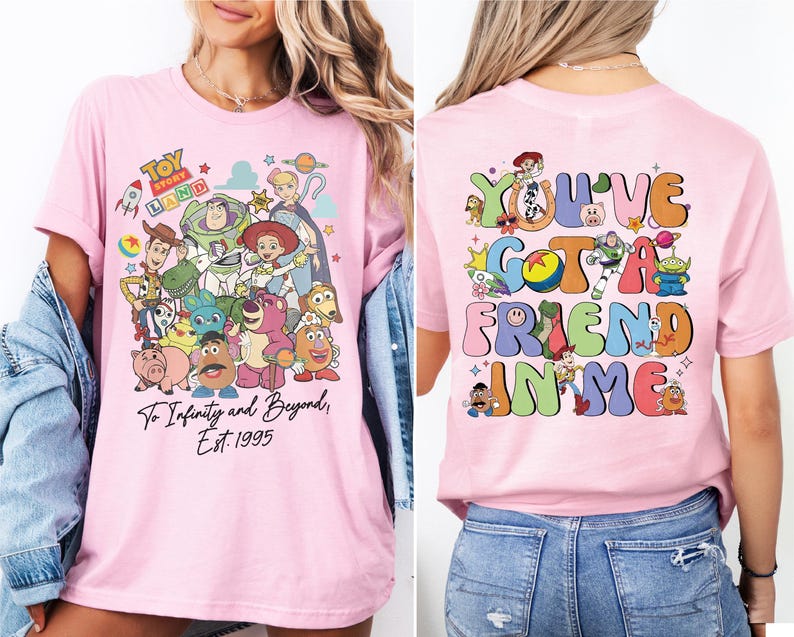 a woman wearing a pink tshirt with cartoon characters on it