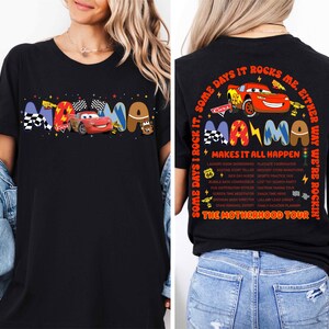 a woman wearing a black shirt with cars on it