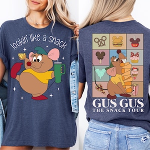 a woman wearing a t - shirt with a cartoon character on it