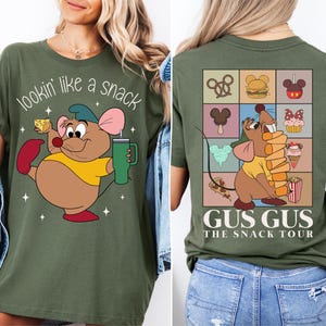 a woman wearing a tshirt with a cartoon character on it
