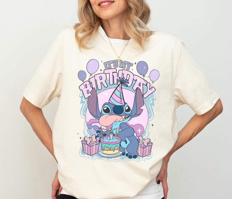 a woman wearing a birthday shirt and shorts