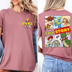 a woman wearing a t - shirt that says toy story