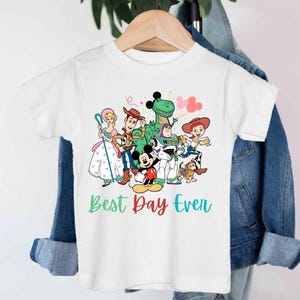 a white t - shirt with cartoon characters on it