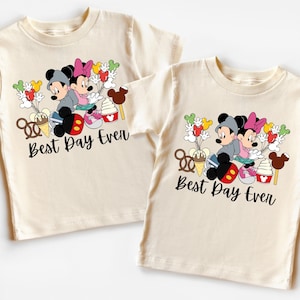 two t - shirts with mickey and minnie mouses on them