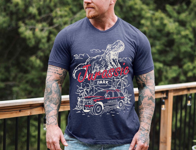 a man with a beard wearing a blue t - shirt