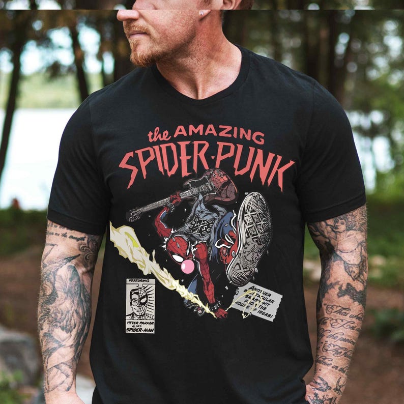 a man wearing a black spider - punk t - shirt