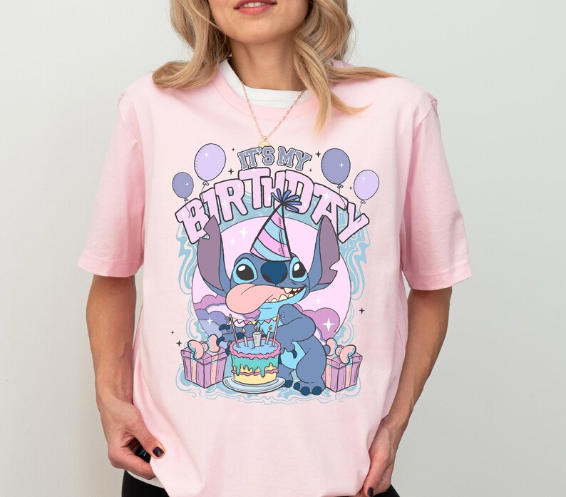 a woman wearing a pink shirt with a stitch stitch stitch stitch stitch stitch stitch stitch