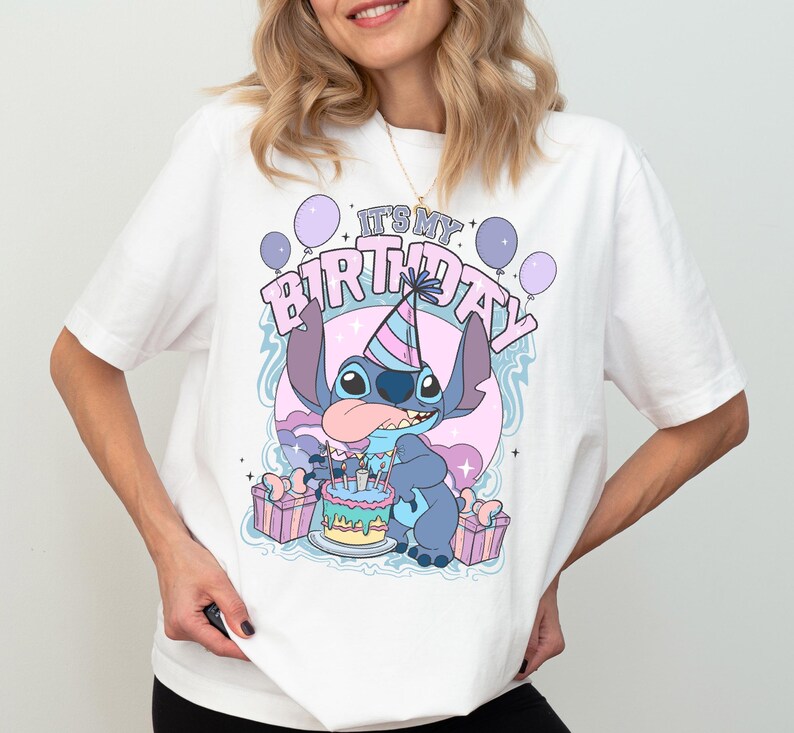a woman wearing a white shirt with a cartoon character on it