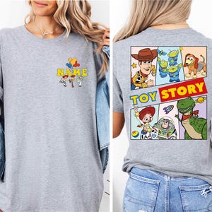 a woman wearing a toy story t - shirt