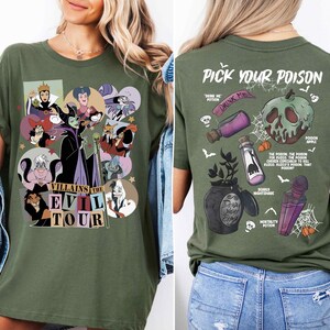 a woman wearing a green t - shirt with cartoon characters on it