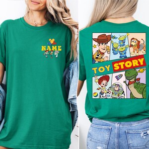 a woman wearing a green toy story t - shirt