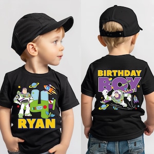 a young boy wearing a birthday boy shirt