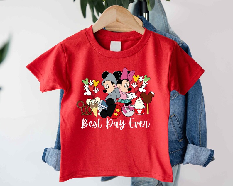 a red shirt with mickey mouse and minnie mouse on it