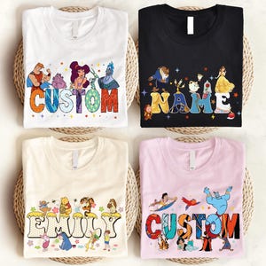 four t-shirts with personalized names and characters printed on them.