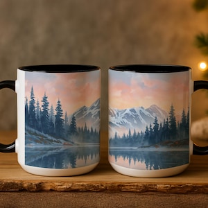 May include: A white ceramic mug with a black handle and the text "But First, Coffee" in a handwritten style. The mug is on a white surface. The mug is approximately 4 inches tall.
