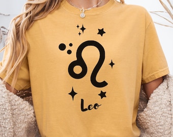 獅子座の星座シャツ、占星術獅子座Tシャツ、獅子座の星座ギフト、グラフィック獅子座シャツ、ミニマルな星座シャツ、獅子座バースデーTシャツ、心地よい色彩、天体シャツ