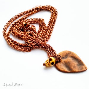 Copper spear and skull necklace, spooky shrunken head