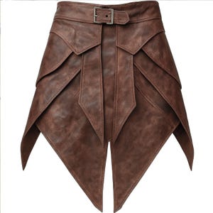 May include: A brown leather skirt with a unique layered design. The skirt features a belt with a silver buckle and multiple overlapping panels that create a geometric shape. The skirt has a textured appearance and a pointed hemline.