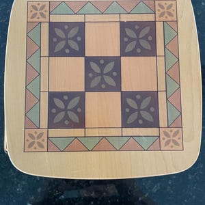 May include: A set of three ceramic mugs with a speckled, matte finish. The mugs are in shades of cream, light gray, and dark gray. Each mug has a simple, minimalist design, perfect for coffee or tea.