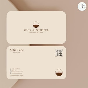 May include: Two beige business cards with rounded corners. The top card reads "WICK & WHISPER Hand-Poured Soy Candles" and has a candle logo. The bottom card shows "Sofia Lane Founder", contact details, a QR code, and a candle logo.