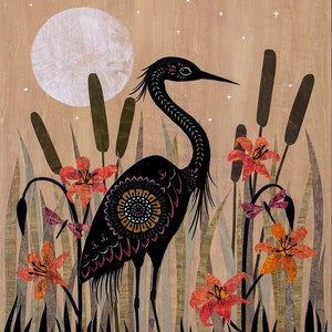 May include: A black heron with intricate patterns stands in a marsh with orange lilies and tall reeds under a full moon and a starry night sky.