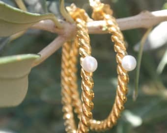 Gold hoop earrings with pearls