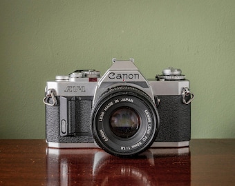 Canon AV-1 35mm SLR Film Camera + 50mm F1.8FD Canon Lens